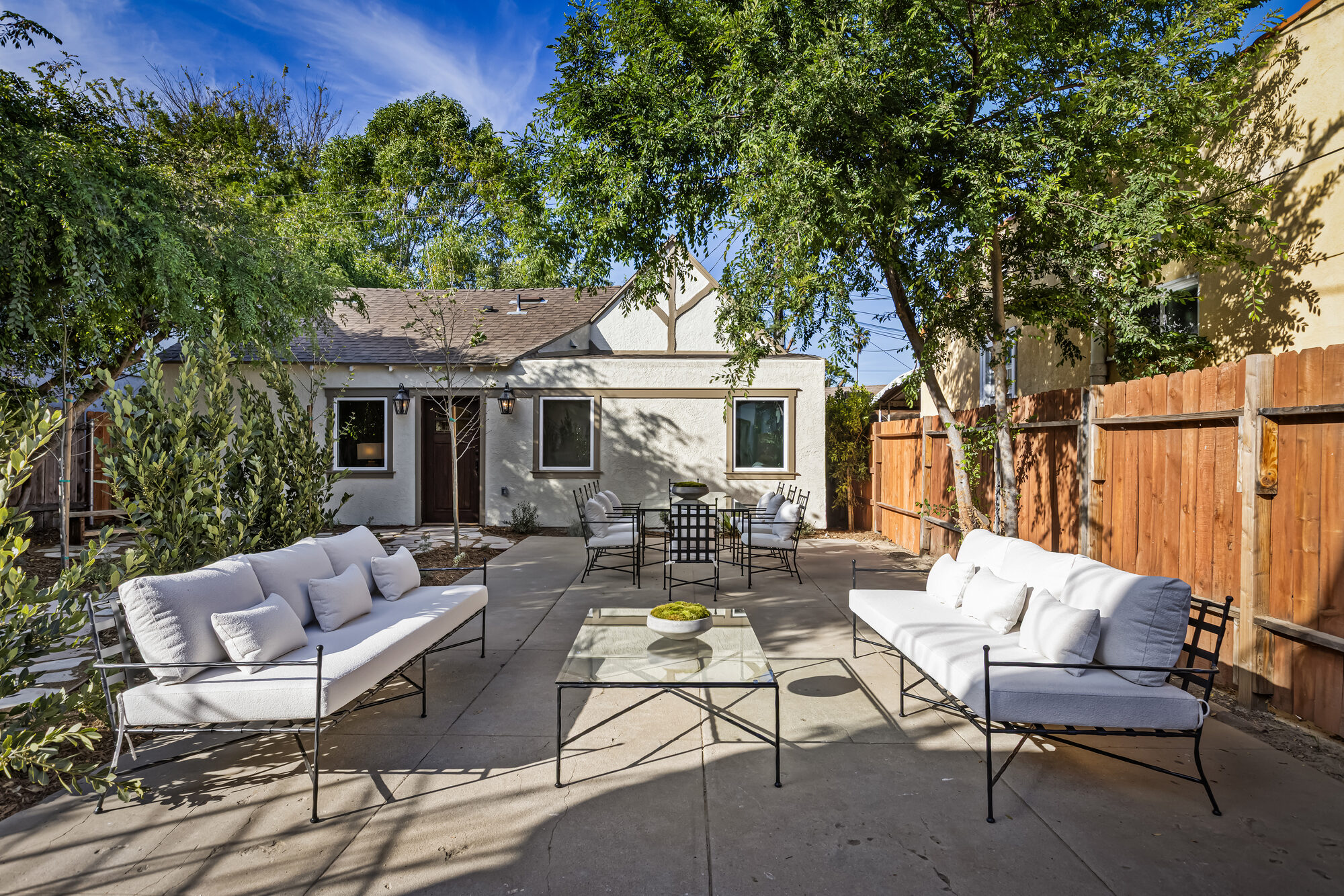 Glenhurst Avenue ADU in Los Angeles at dusk, with flagstone patio and landscaped yard